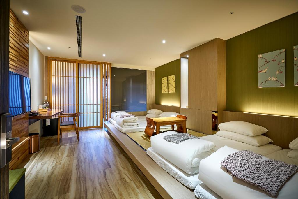Postel nebo postele na pokoji v ubytování Shine Mood Resort Yuanli