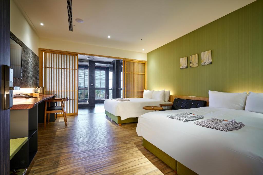 Postel nebo postele na pokoji v ubytování Shine Mood Resort Yuanli