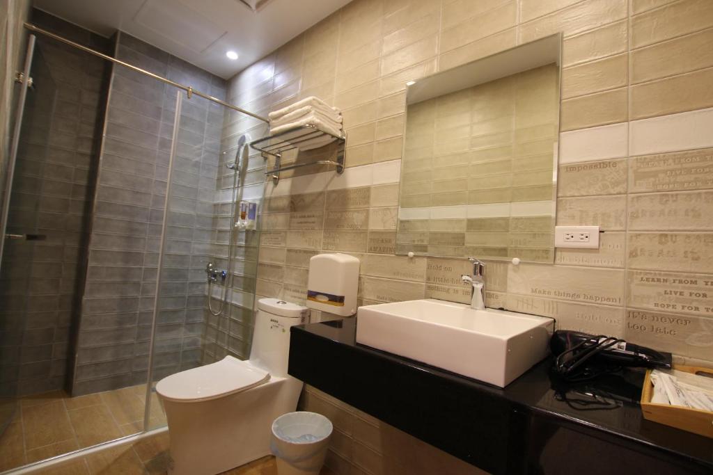 Koupelna v ubytování Lang Qin B&B