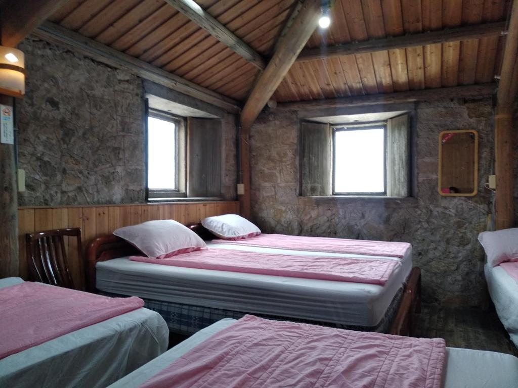 Postel nebo postele na pokoji v ubytování Chin -Be Village Cafe & Homestay