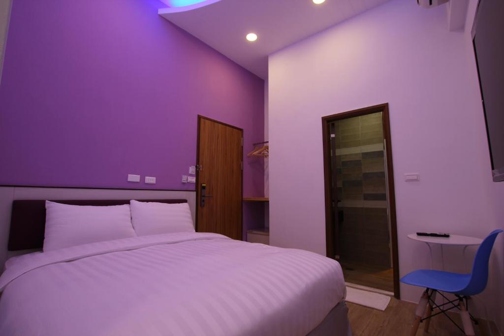 Postel nebo postele na pokoji v ubytování Lang Qin B&B