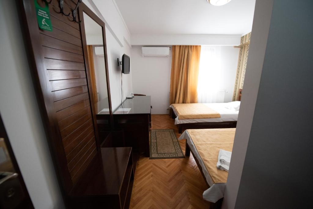 Postel nebo postele na pokoji v ubytování Pension Arena