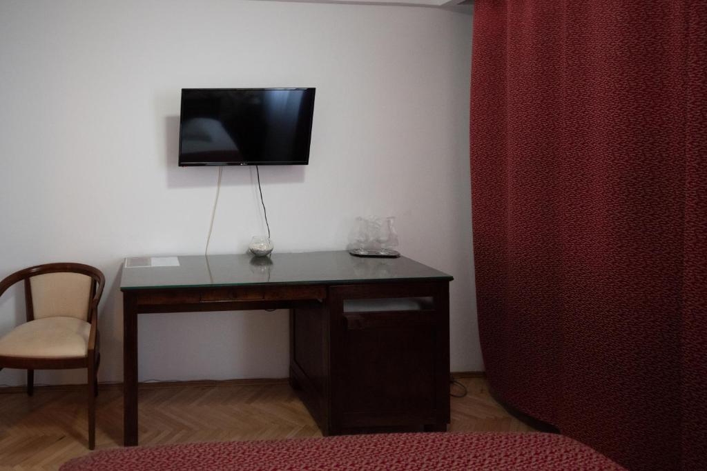 TV a/nebo společenská místnost v ubytování Pension Arena