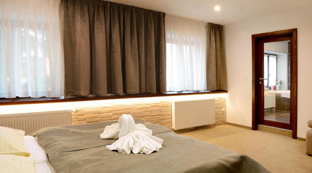 Кровать или кровати в номере Restaurace a penzion pod hradem