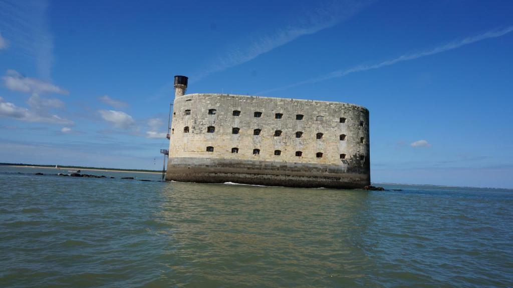 a building in the middle of the water at La Rochelle sur L'eau in La Rochelle