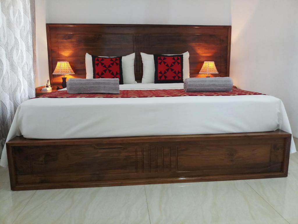 Postel nebo postele na pokoji v ubytování Shani Residence Kandy