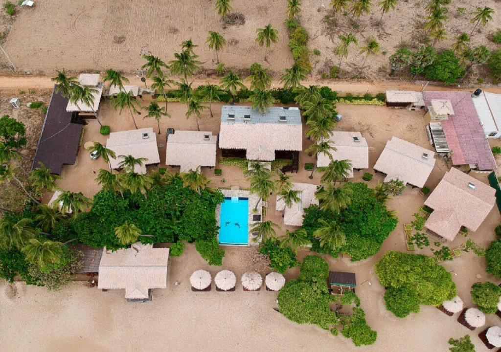 an aerial view of a resort with a swimming pool at Nilaveli Beach Resort - Level 1 Certified in Nilaveli