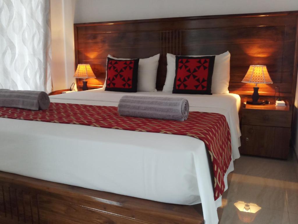 Postel nebo postele na pokoji v ubytování Shani Residence Kandy