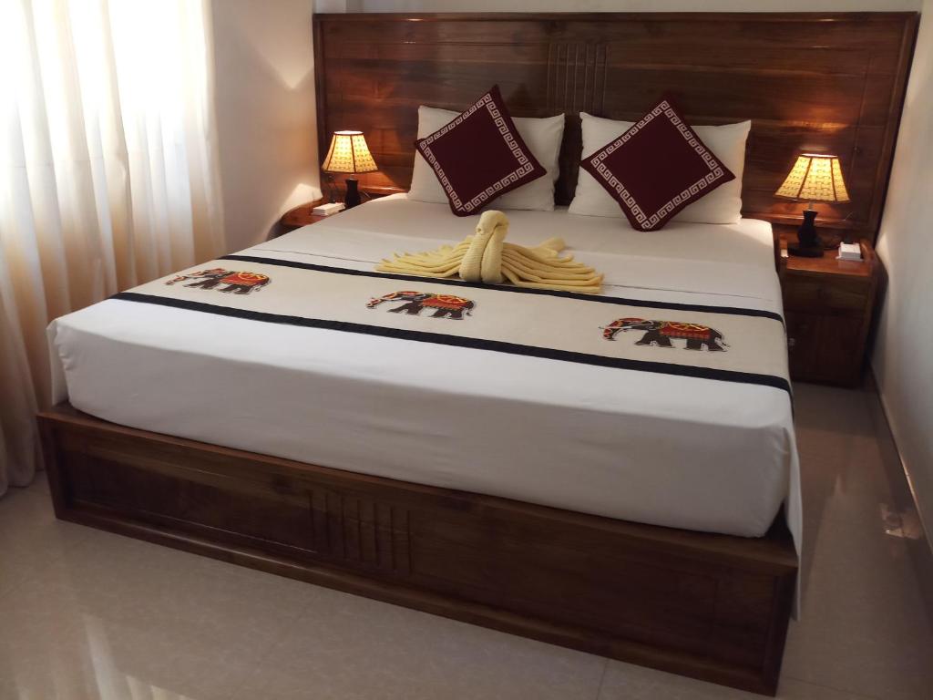 Postel nebo postele na pokoji v ubytování Shani Residence Kandy