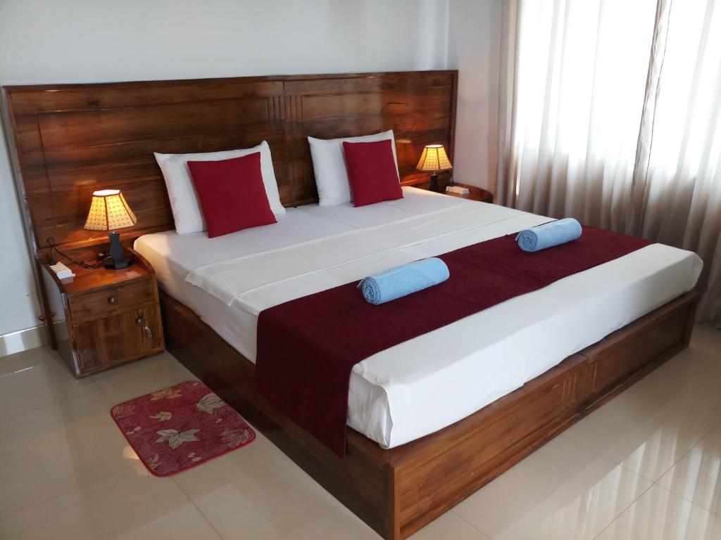 Postel nebo postele na pokoji v ubytování Shani Residence Kandy
