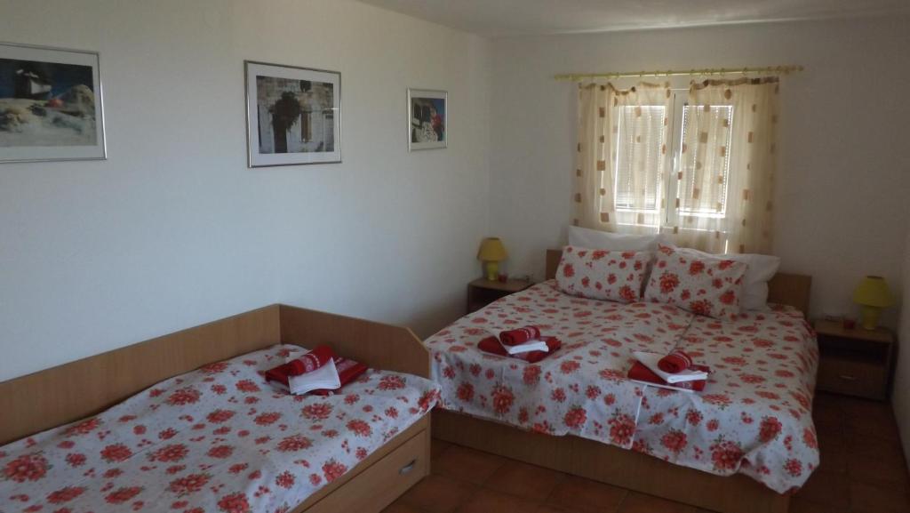 Voodi või voodid majutusasutuse Luštica Apartments toas
