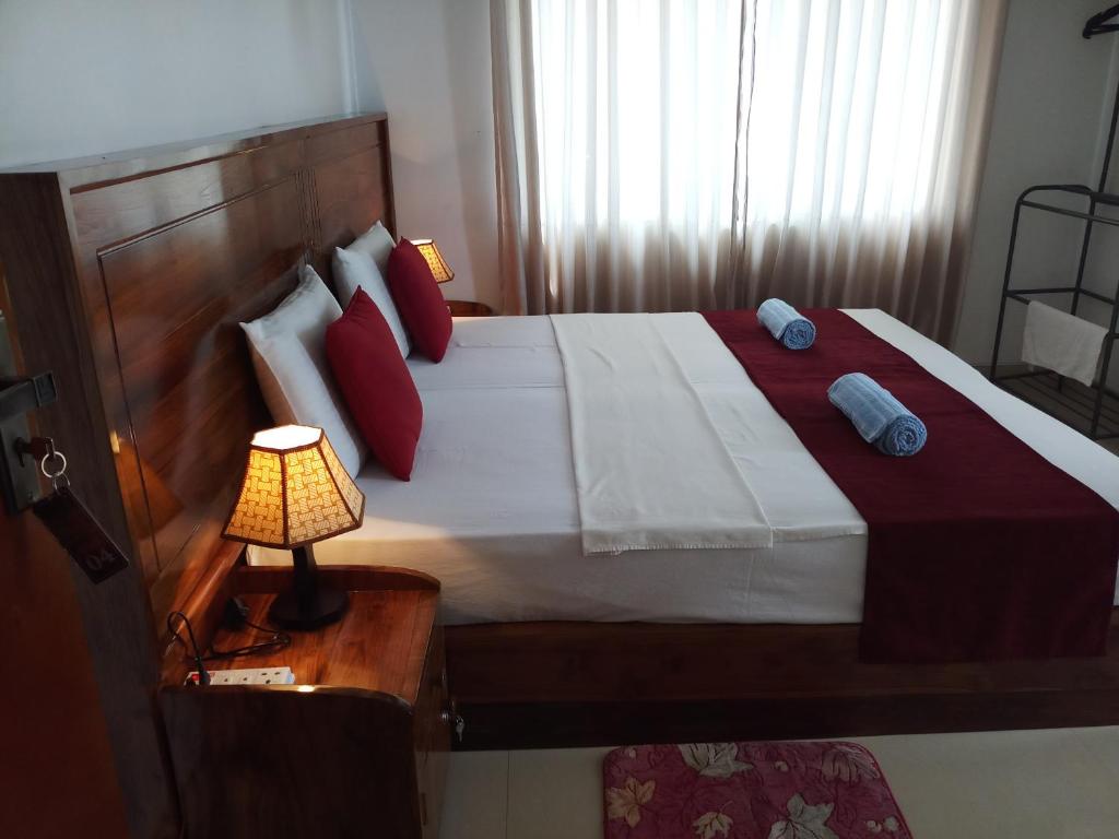 Postel nebo postele na pokoji v ubytování Shani Residence Kandy