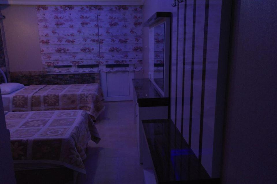Postel nebo postele na pokoji v ubytování Dolphin Yunus Hotel