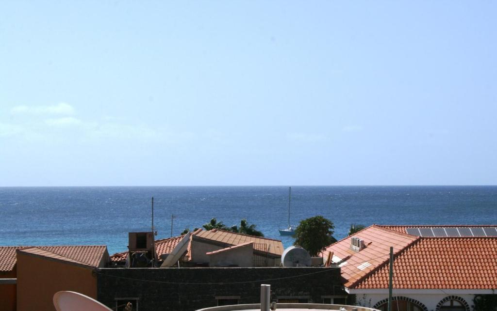 a view of the ocean from the roofs of buildings at Home sweet home in Santa Maria