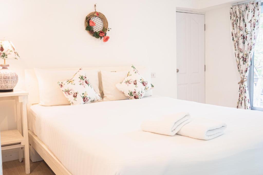 Postel nebo postele na pokoji v ubytování The C Samet Beach Resort SHA Plus