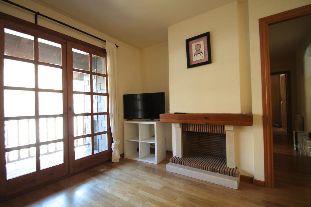 TV a/nebo společenská místnost v ubytování Ensagents, Canillo centro, Zona Grandvalira