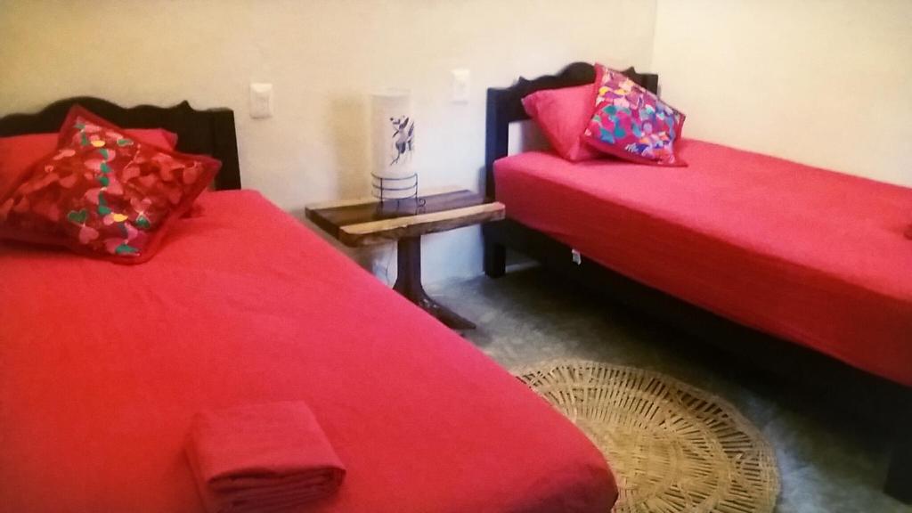 Postel nebo postele na pokoji v ubytování Tubo Tulum Hostel