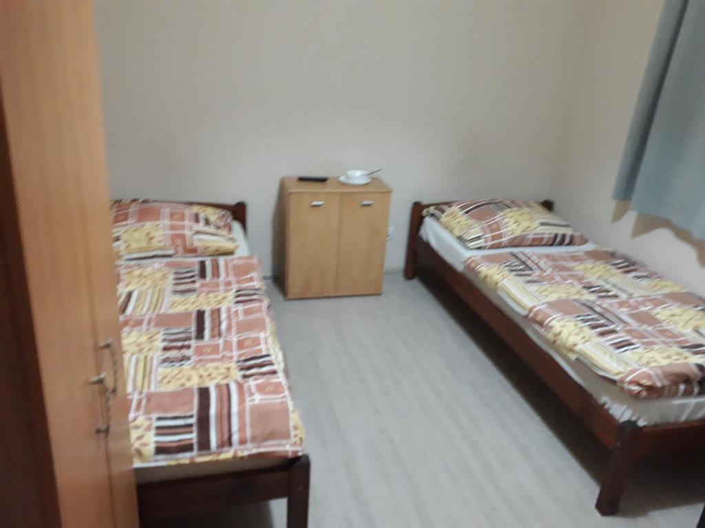 Postel nebo postele na pokoji v ubytování Noclegi Pod Kasztanami