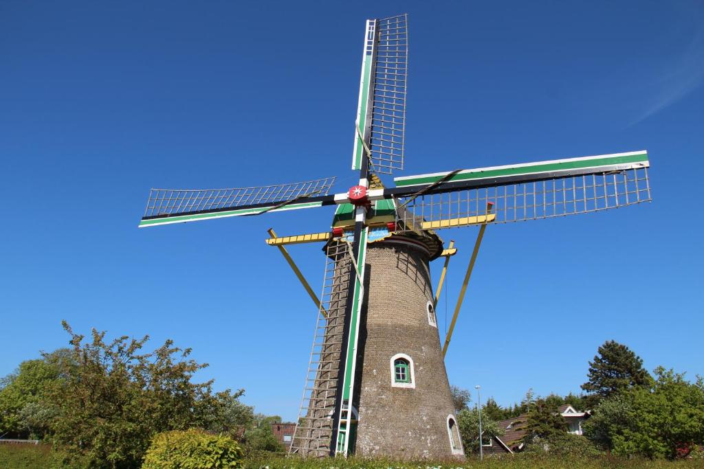 a windmill with a solar panel on top of it at Vakantiehuis in het Centrum van Domburg DO19 in Domburg
