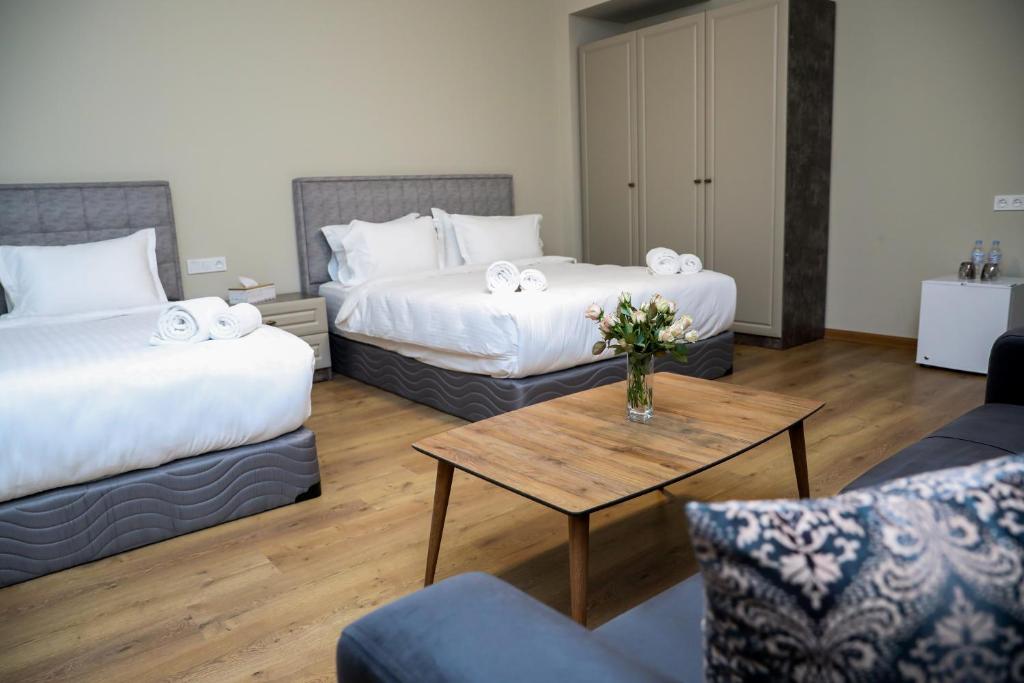 Postel nebo postele na pokoji v ubytování Teryan Pushkin Apart Hotel