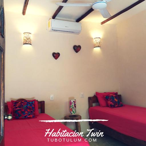 Postel nebo postele na pokoji v ubytování Tubo Tulum Hostel