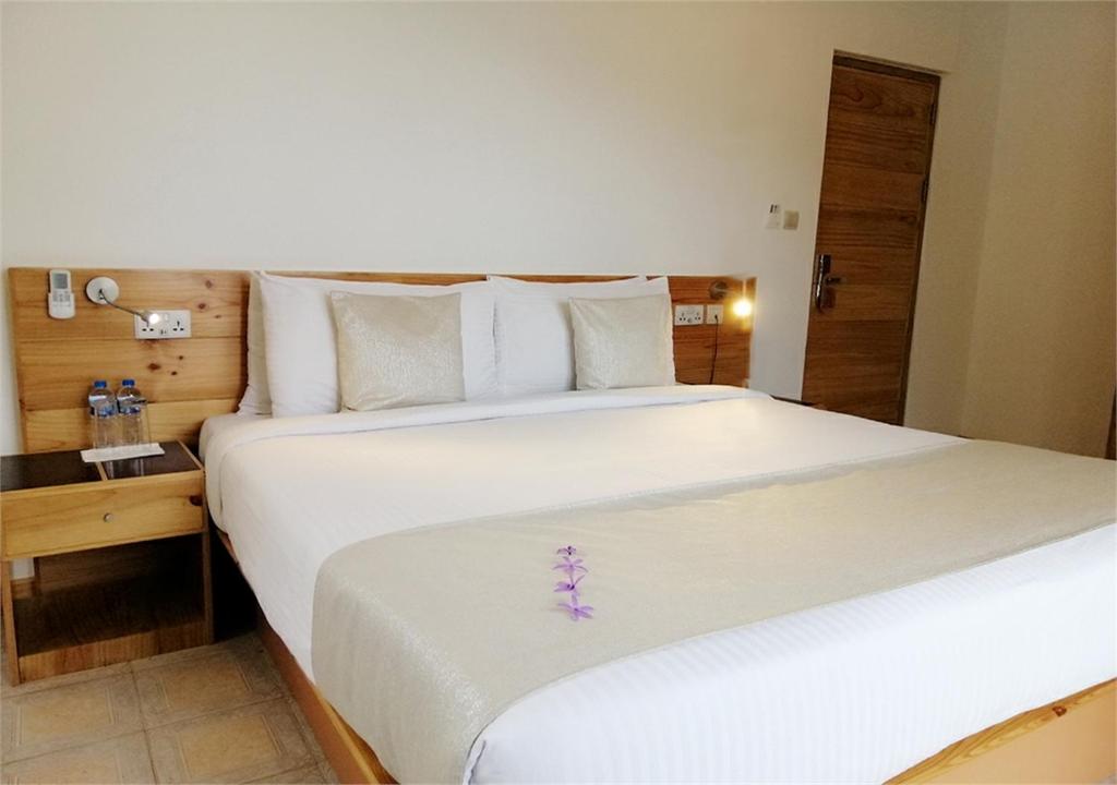 Postel nebo postele na pokoji v ubytování Le Relax Hotel and Restaurant