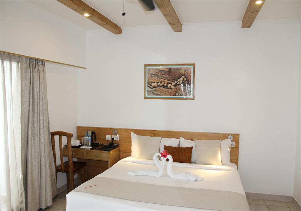 Postel nebo postele na pokoji v ubytování Le Relax Hotel and Restaurant