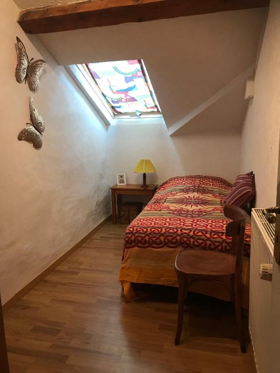 Postel nebo postele na pokoji v ubytování Petit Château