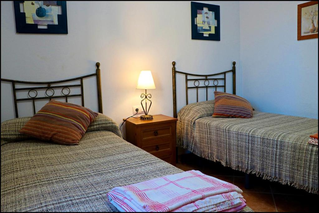 Łóżko lub łóżka w pokoju w obiekcie Chalet con piscina privada