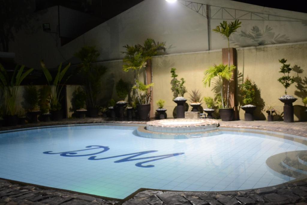 a large swimming pool with the word spa on it at DM Residente Villas in Angeles