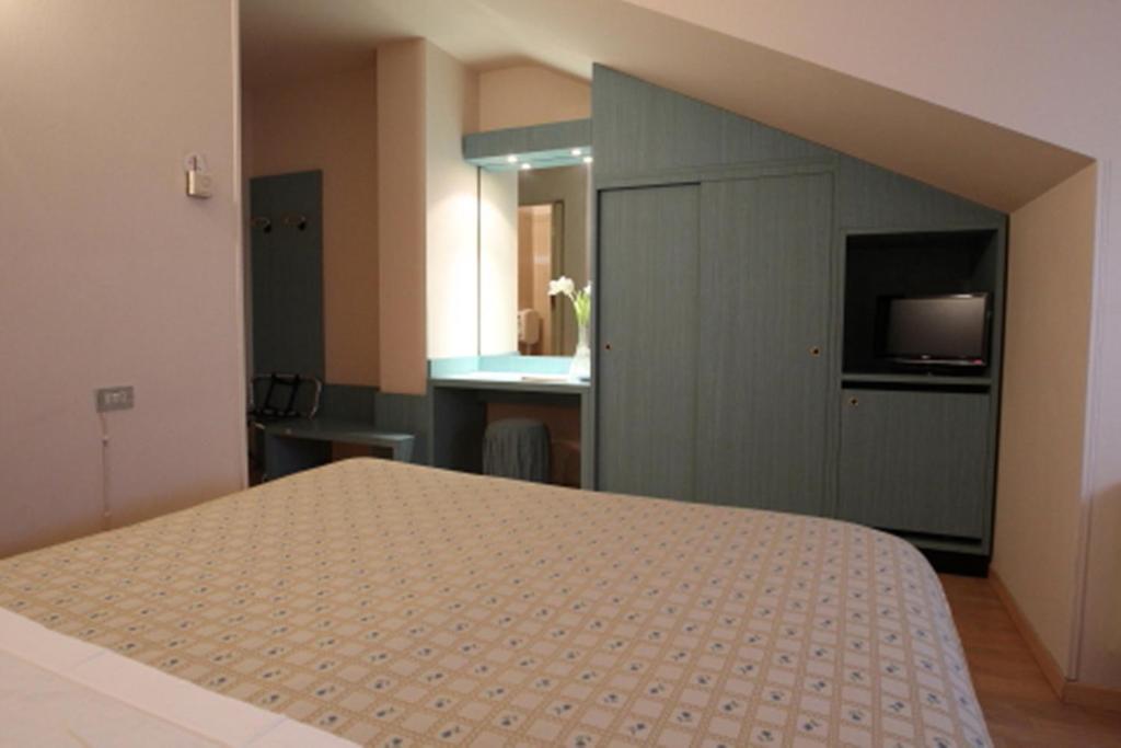Postel nebo postele na pokoji v ubytování Hotel Globo