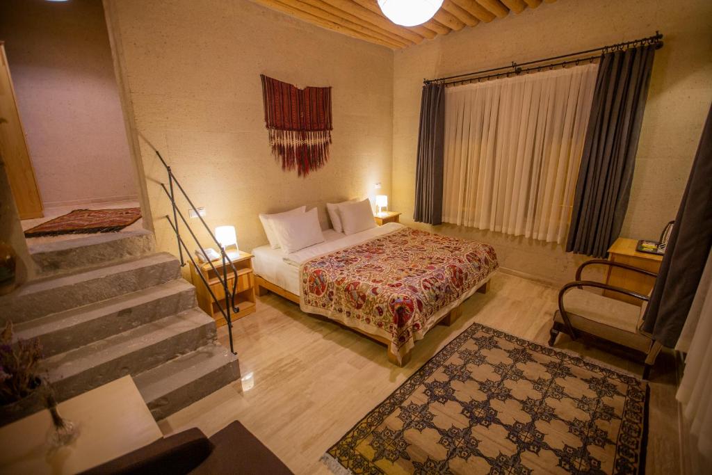 Postel nebo postele na pokoji v ubytování Maze Of Cappadocia Hotel