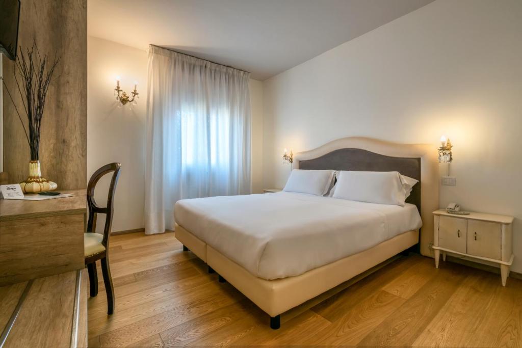 Postel nebo postele na pokoji v ubytování Hotel Globo