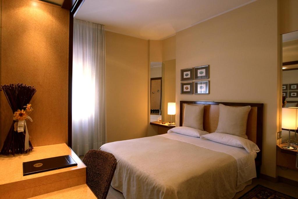 Postel nebo postele na pokoji v ubytování Hotel Globo