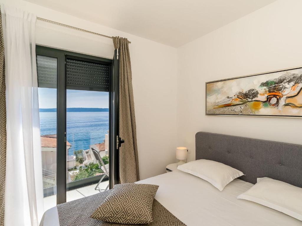 Posteľ alebo postele v izbe v ubytovaní Holiday Home Villa Meri 2 by Interhome