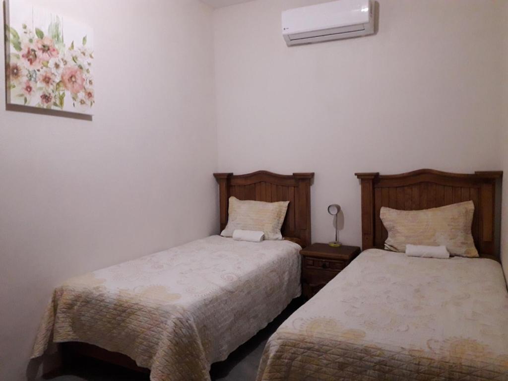 Postel nebo postele na pokoji v ubytování Hotel Purisima Concepción