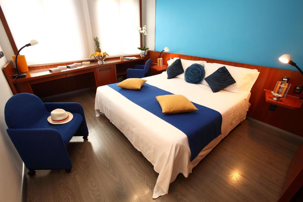 Postel nebo postele na pokoji v ubytování Hotel Mediolanum