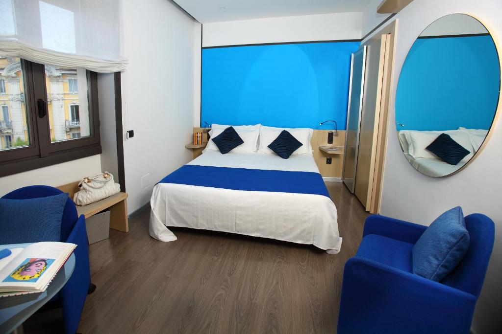 Postel nebo postele na pokoji v ubytování Hotel Mediolanum