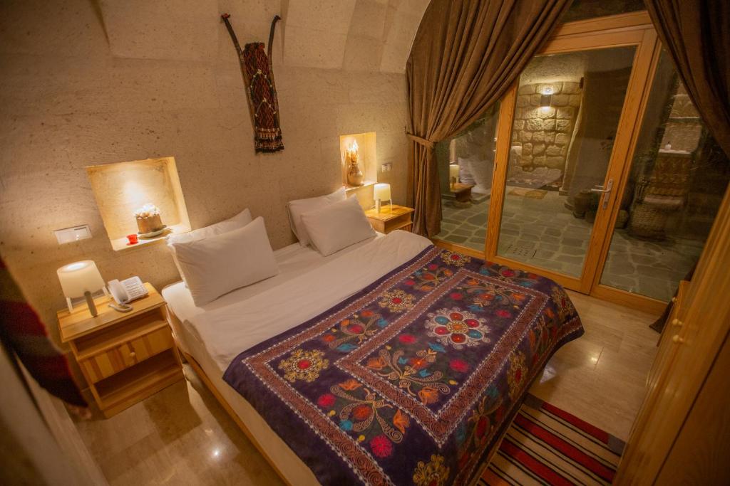 Postel nebo postele na pokoji v ubytování Maze Of Cappadocia Hotel