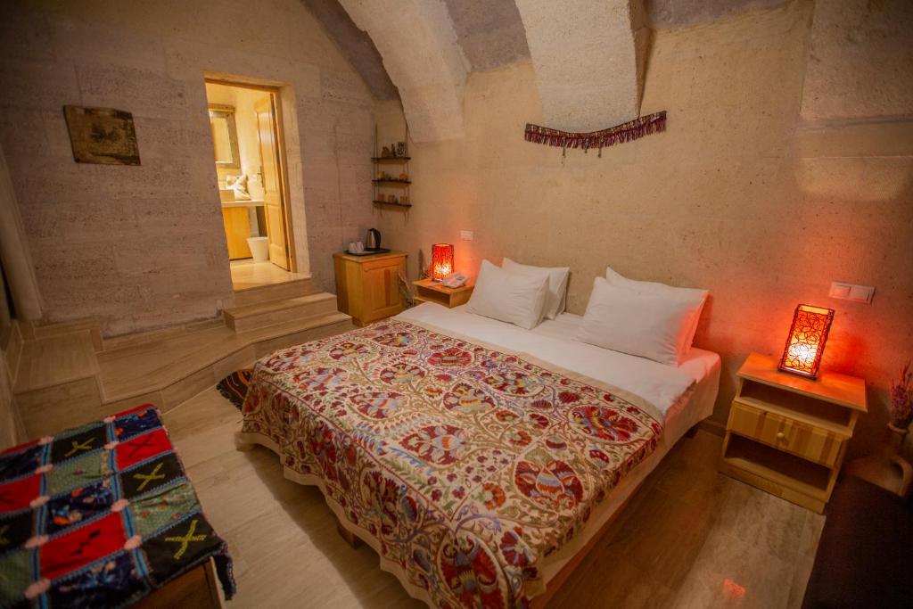 Postel nebo postele na pokoji v ubytování Maze Of Cappadocia Hotel