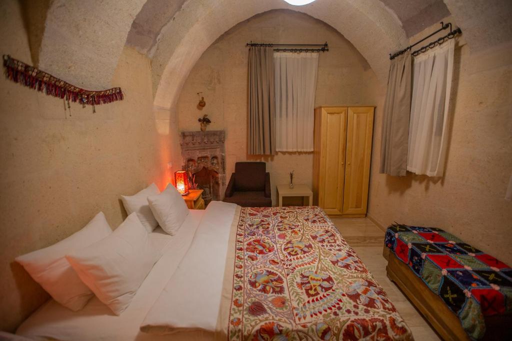 Postel nebo postele na pokoji v ubytování Maze Of Cappadocia Hotel