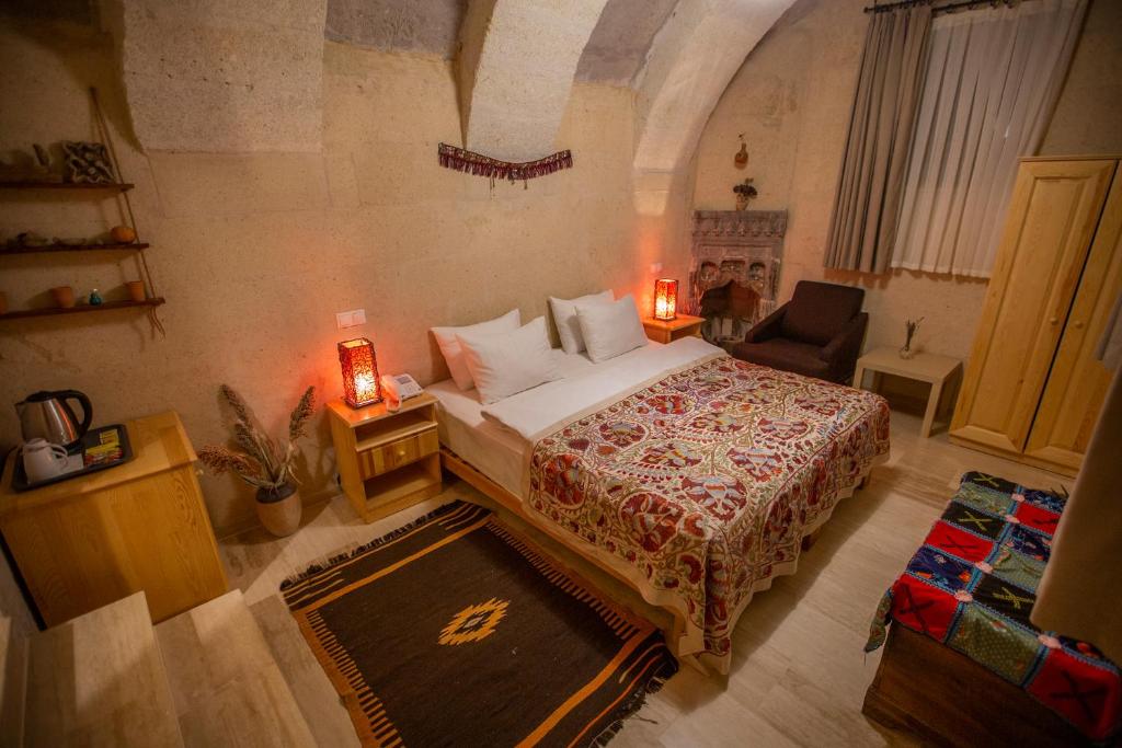 Postel nebo postele na pokoji v ubytování Maze Of Cappadocia Hotel