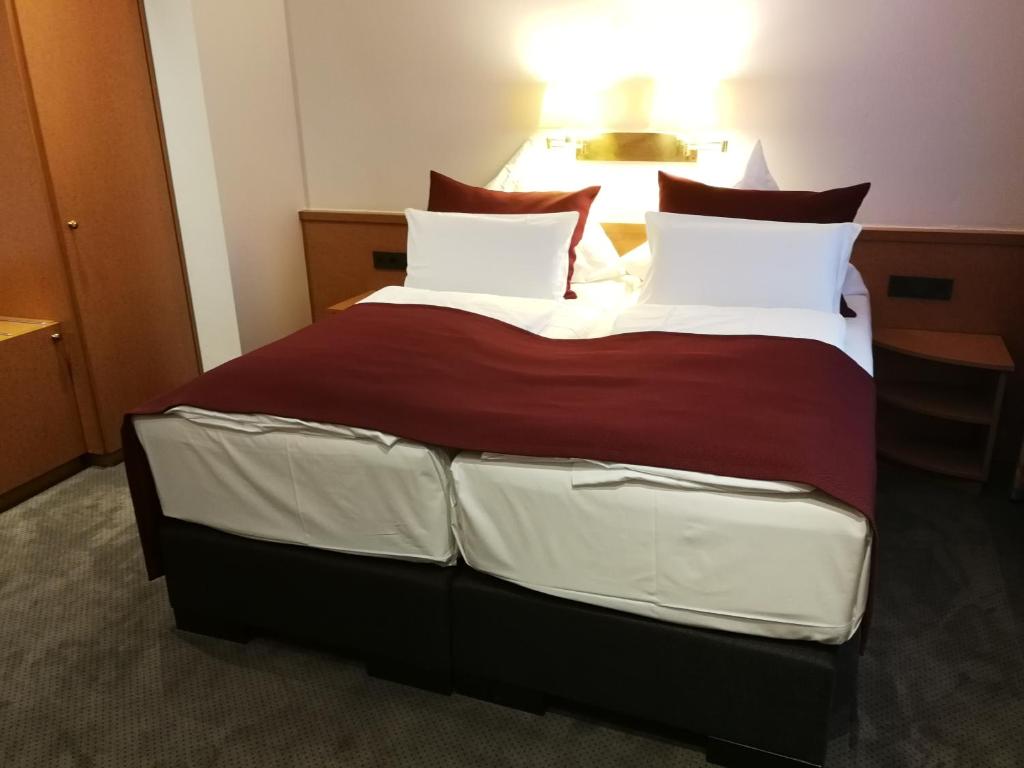 Postel nebo postele na pokoji v ubytování Hotel An der Philharmonie