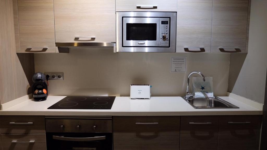 Kuchyň nebo kuchyňský kout v ubytování Apartamentos Real Lleida