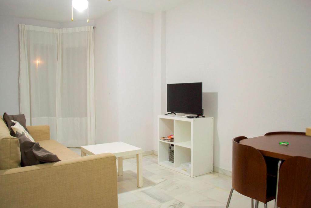 TV a/nebo společenská místnost v ubytování Oceanfront