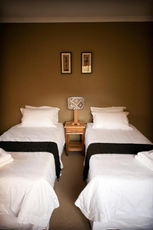 Postel nebo postele na pokoji v ubytování Nukakamma Guest House