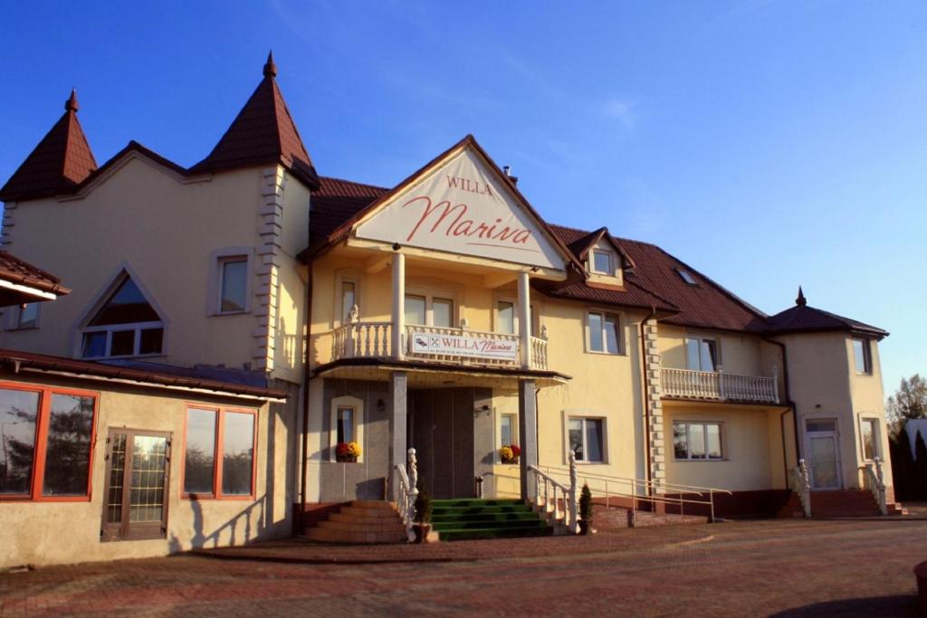 a large building with a sign that reads marmite at Willa Marina in Łódź