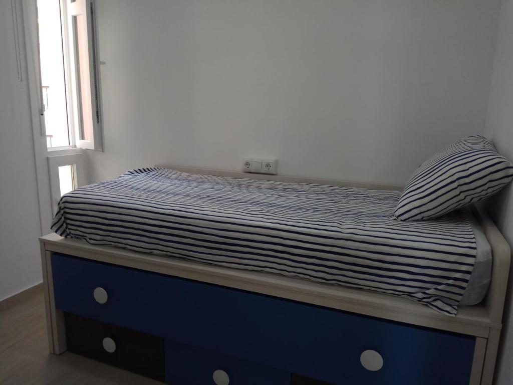 Postel nebo postele na pokoji v ubytování Esplendido APARTAMENTO, CARIHUELA EDIFICIO EL REMO, PRIMERA LÍNEA