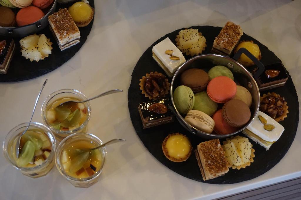 a table with two plates of food and two glasses at ONOMO Hotel Tanger Med in Tangier