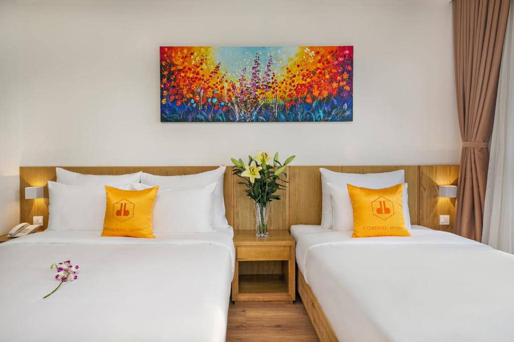 Postel nebo postele na pokoji v ubytování Cordial Beach Hotel Da Nang